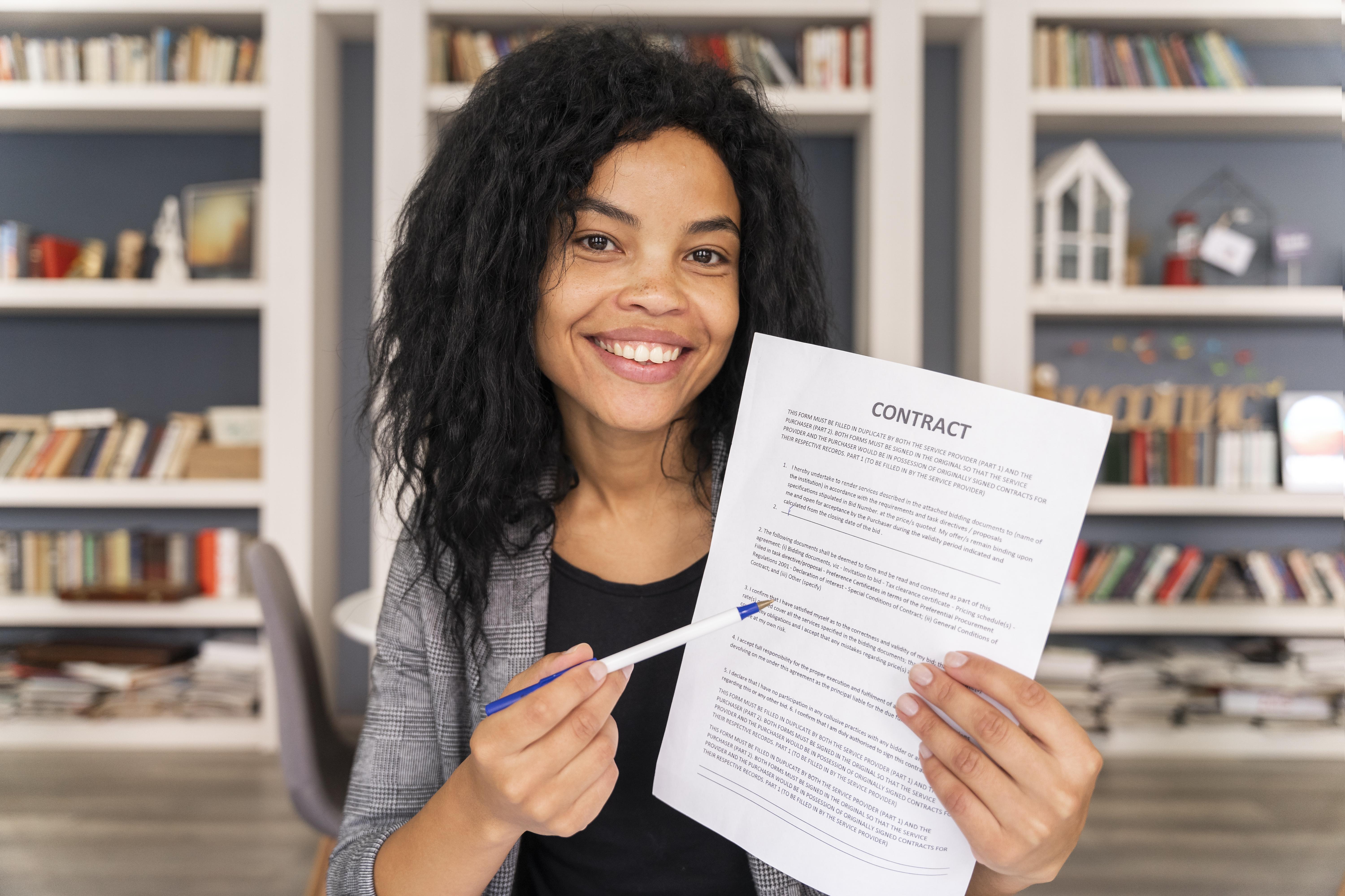 Professional woman holding a contract document, representing career success with SmartCV Generator